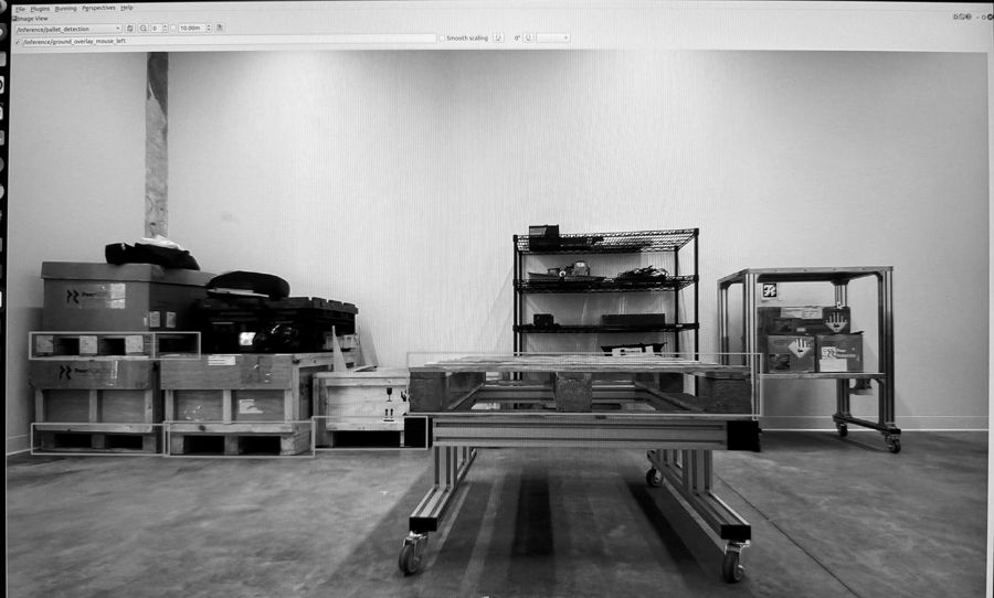 Pallet detection print: YOLOv11 boxes around stacked pallets and a pallet on a cart in a warehouse, from the repository